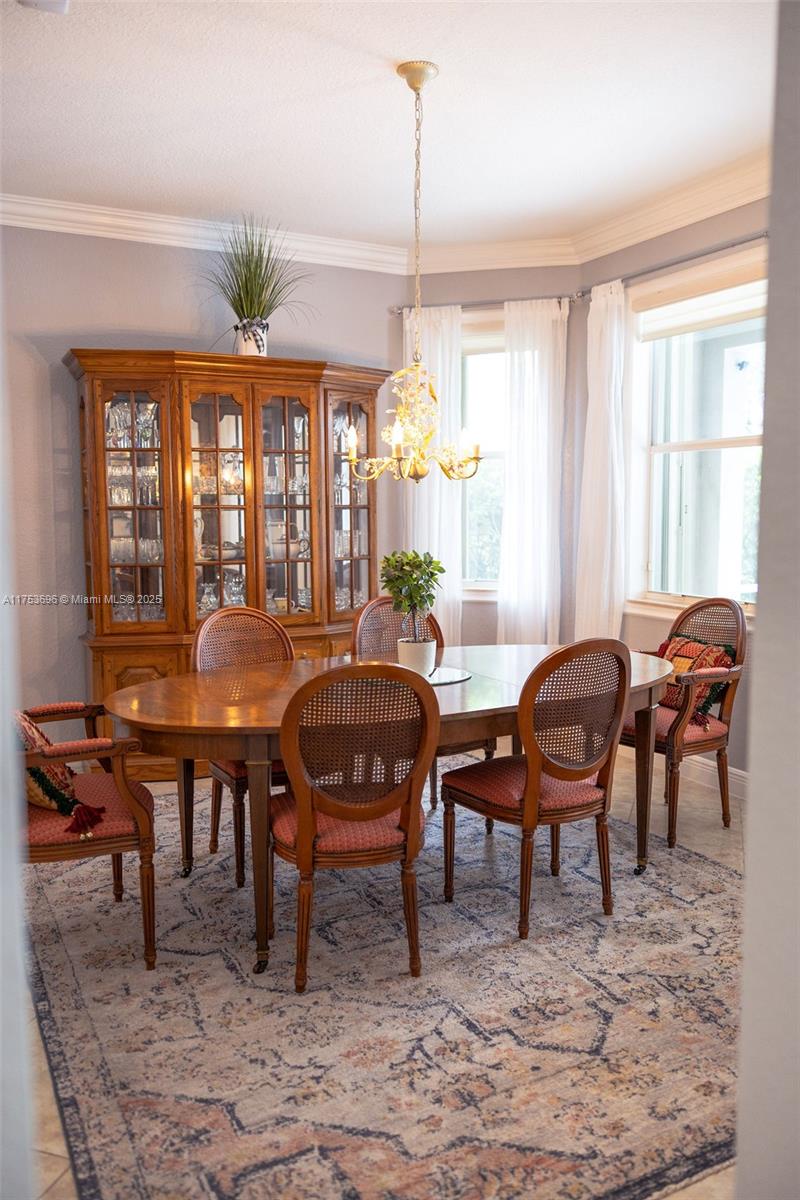 3923 Cascade Terrace Weston, FL 33332 - Photo 15 of 82 a view of a dining room with furniture window and outside view