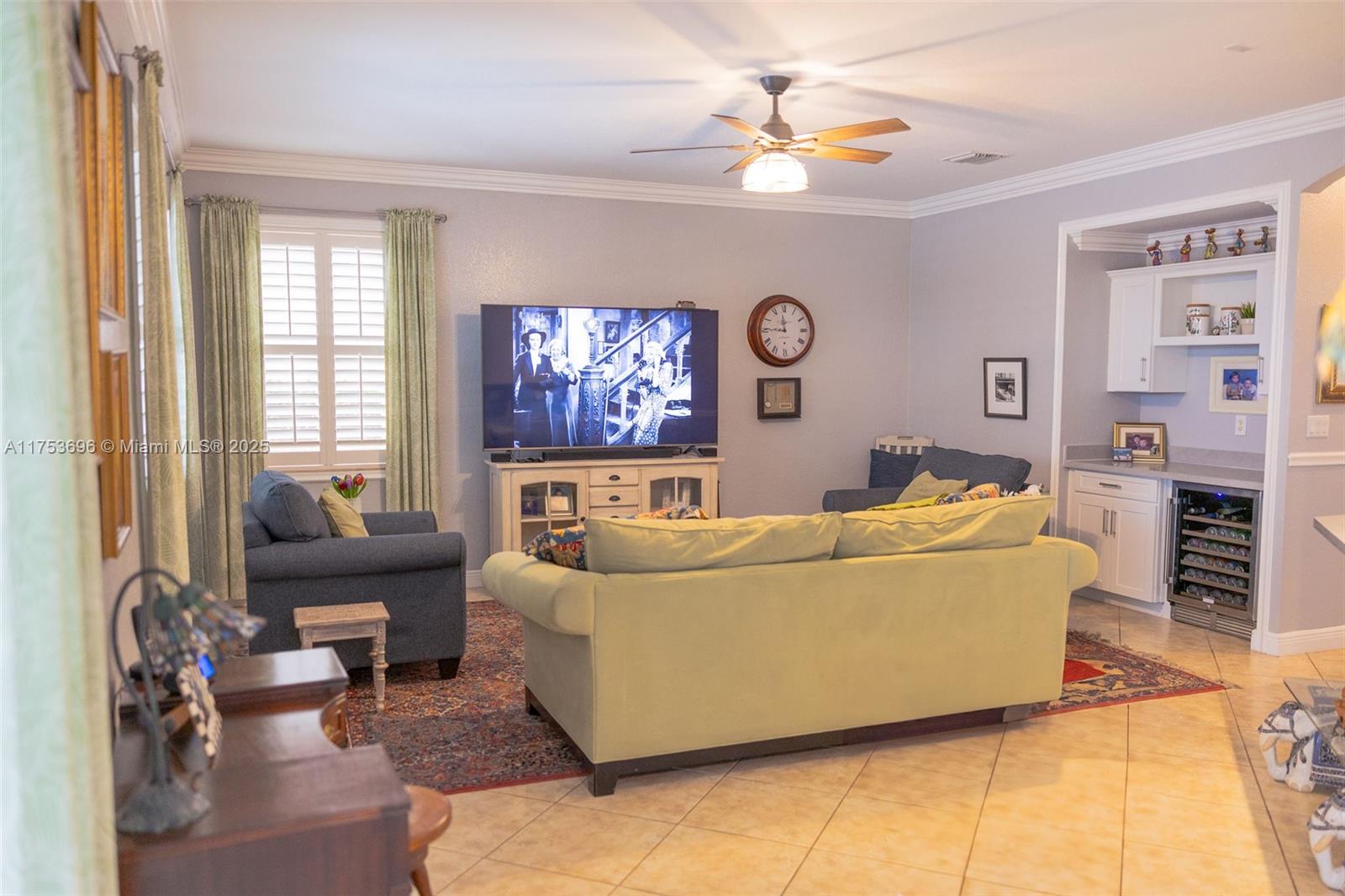 3923 Cascade Terrace Weston, FL 33332 - Photo 24 of 82 a living room with furniture and a flat screen tv