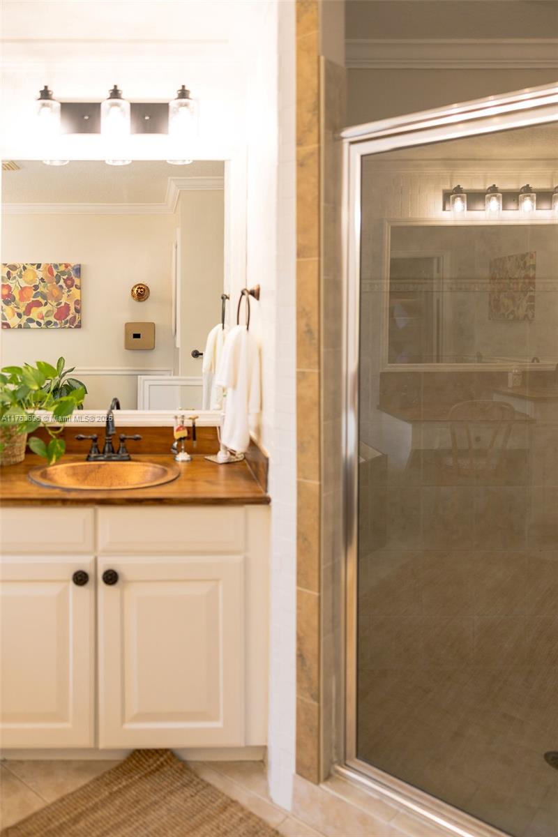 3923 Cascade Terrace Weston, FL 33332 - Photo 49 of 82 a bathroom with a sink and a mirror