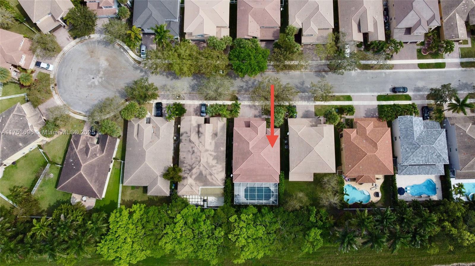 3923 Cascade Terrace Weston, FL 33332 - Photo 74 of 82 an aerial view of a house with a yard and large trees