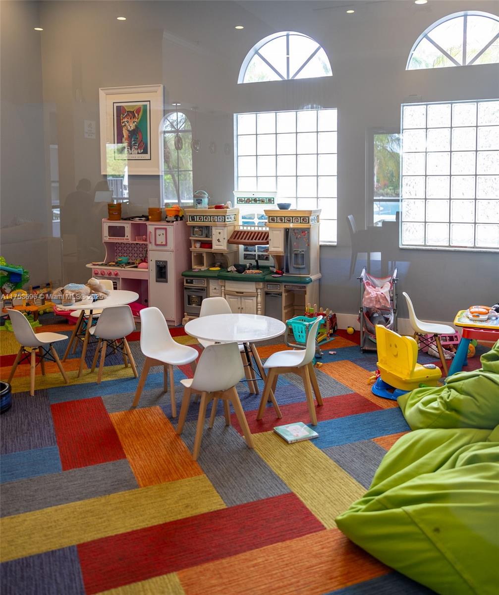 3923 Cascade Terrace Weston, FL 33332 - Photo 80 of 82 a living room with lots of furniture and a wooden floor