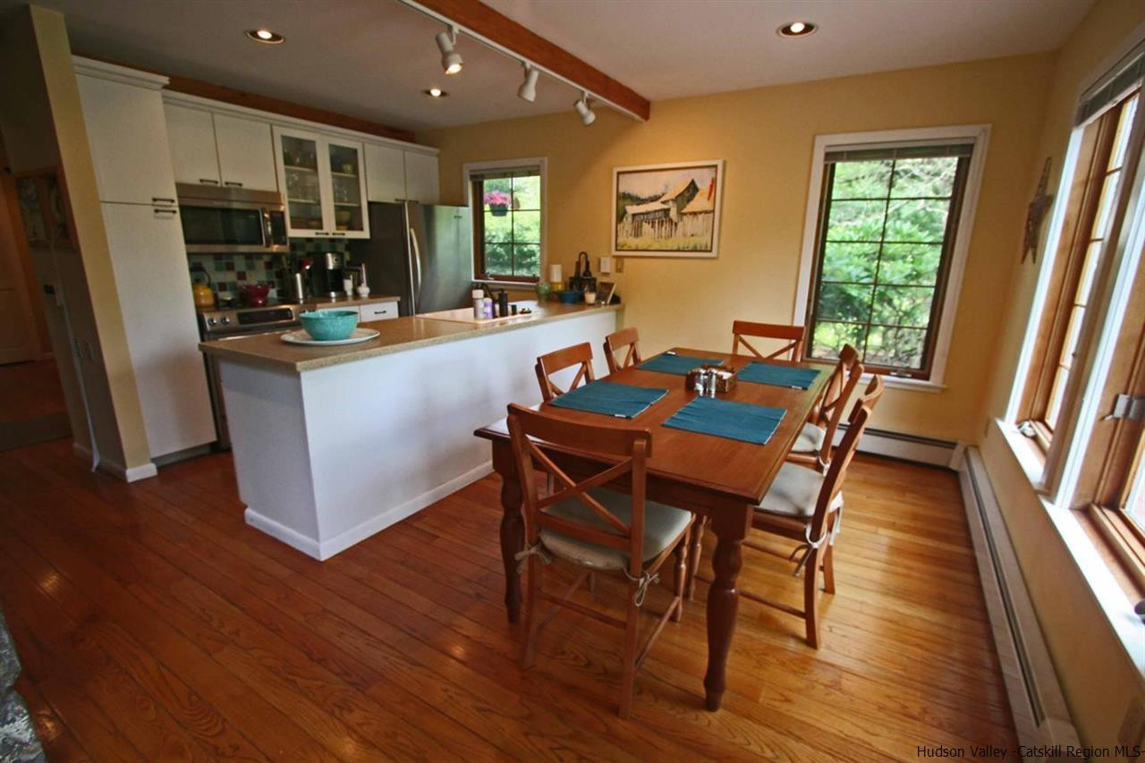318 Autumn Breeze Road Roxbury, NY 12421 - Photo 13 of 35 a dining room with furniture and wooden floor