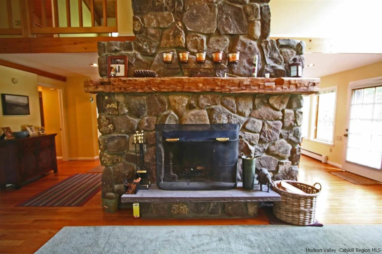 318 Autumn Breeze Road Roxbury, NY 12421 - Photo 10 of 35 a living room with fireplace furniture and a wooden floor
