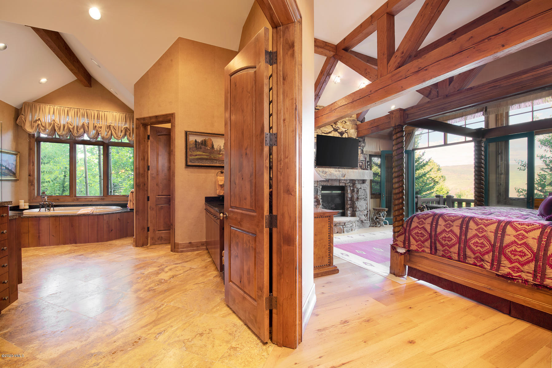 919 Bachelor Ridge Road Avon, CO 81620 - Photo 15 of 31 a view of living room kitchen with furniture and floor to ceiling window