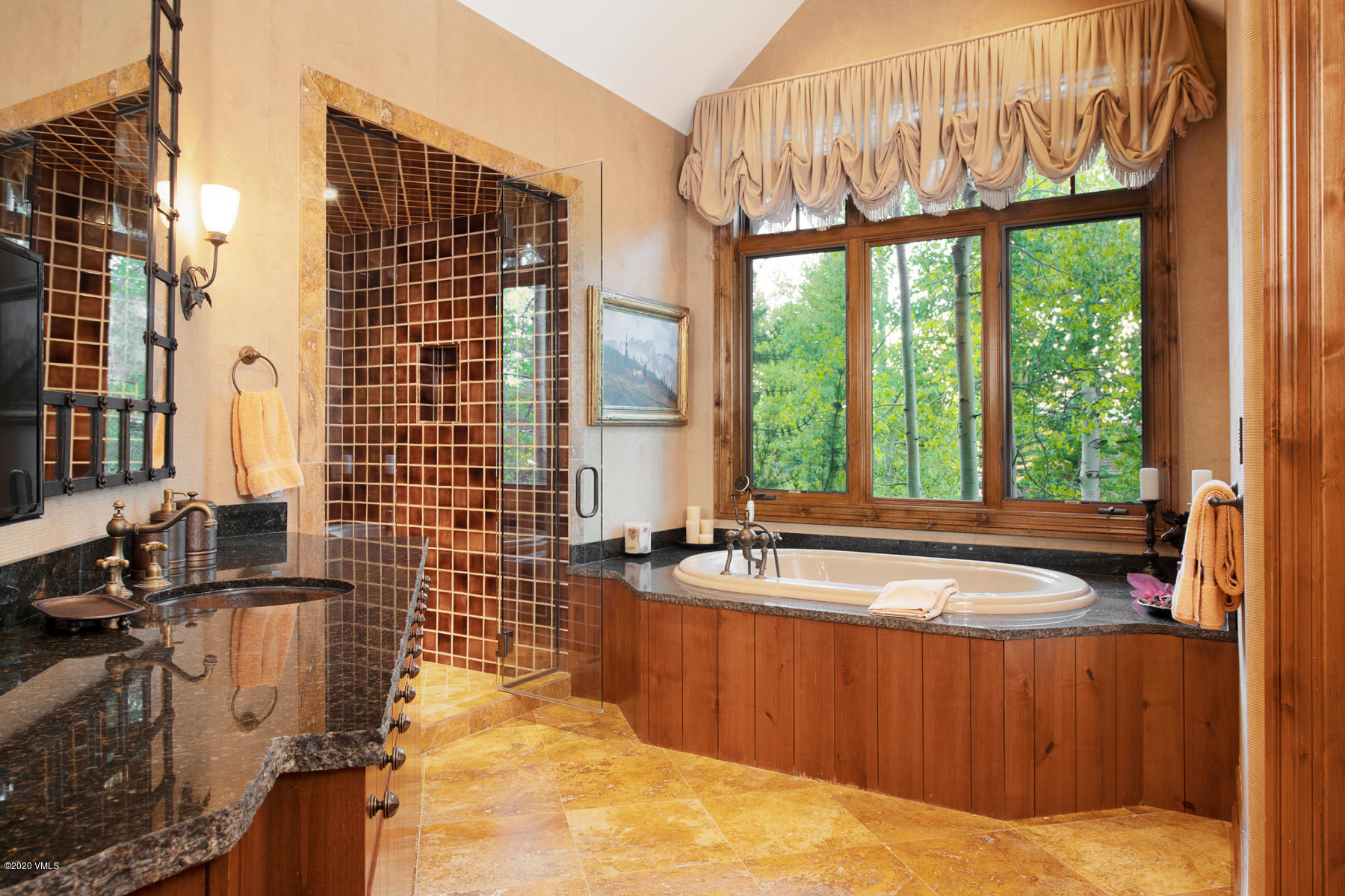 919 Bachelor Ridge Road Avon, CO 81620 - Photo 16 of 31 a bath room with a sink and a bath tub