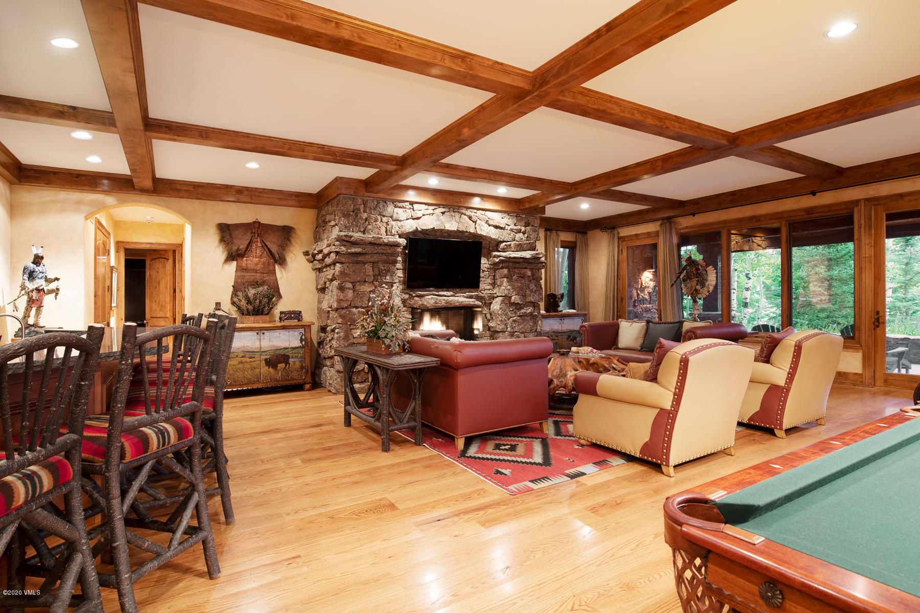 919 Bachelor Ridge Road Avon, CO 81620 - Photo 18 of 31 a living room with patio furniture and a flat screen tv