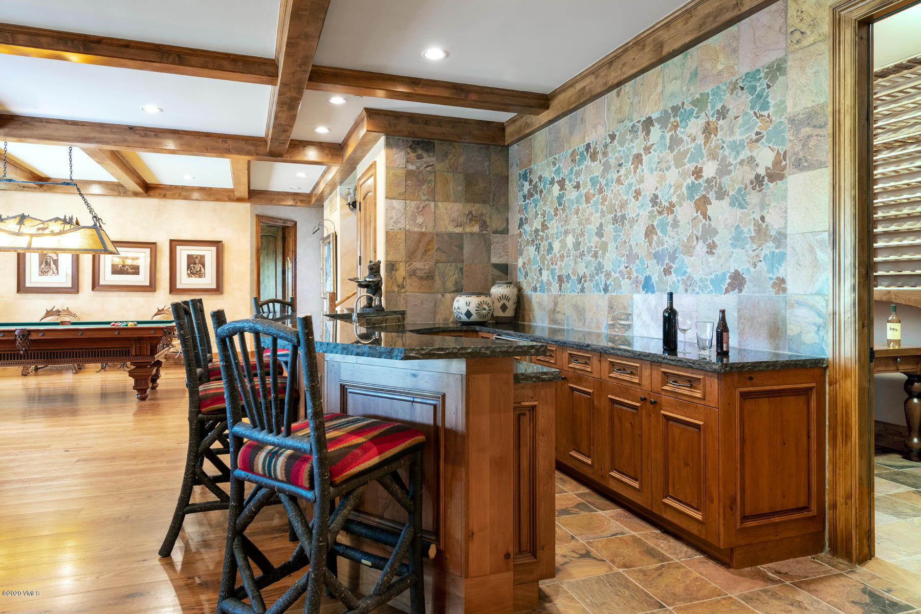 919 Bachelor Ridge Road Avon, CO 81620 - Photo 19 of 31 a dining room with furniture and wooden floor