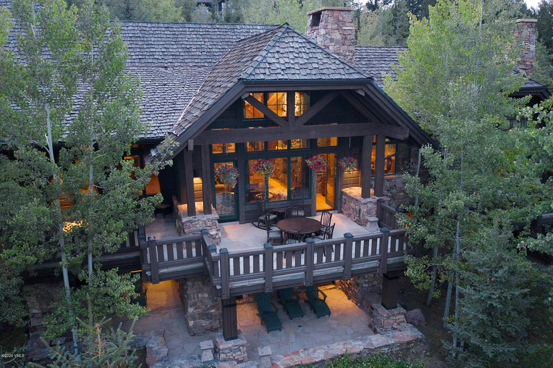 919 Bachelor Ridge Road Avon, CO 81620 - Photo 31 of 31 a view of a brick house with pool and chairs