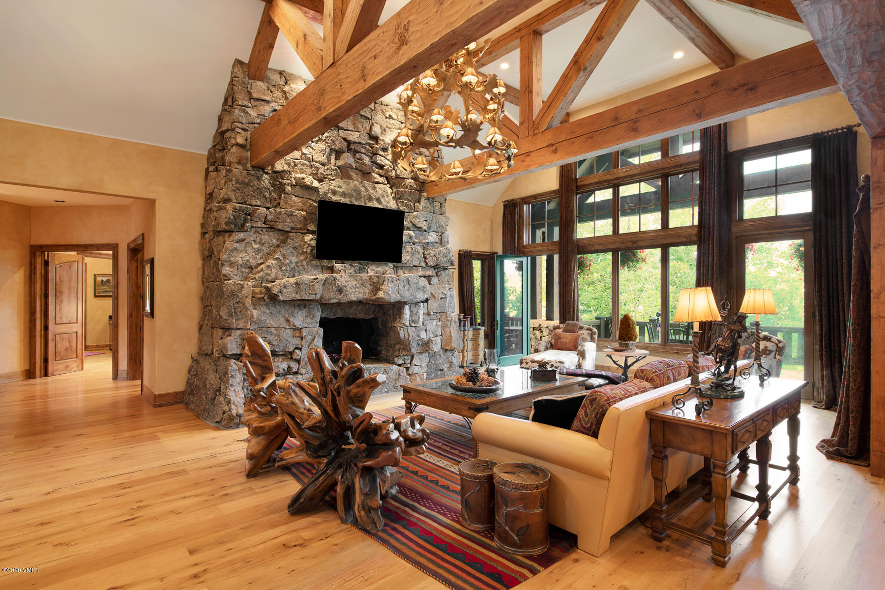 919 Bachelor Ridge Road Avon, CO 81620 - Photo 5 of 31 a living room with fireplace furniture and a flat screen tv