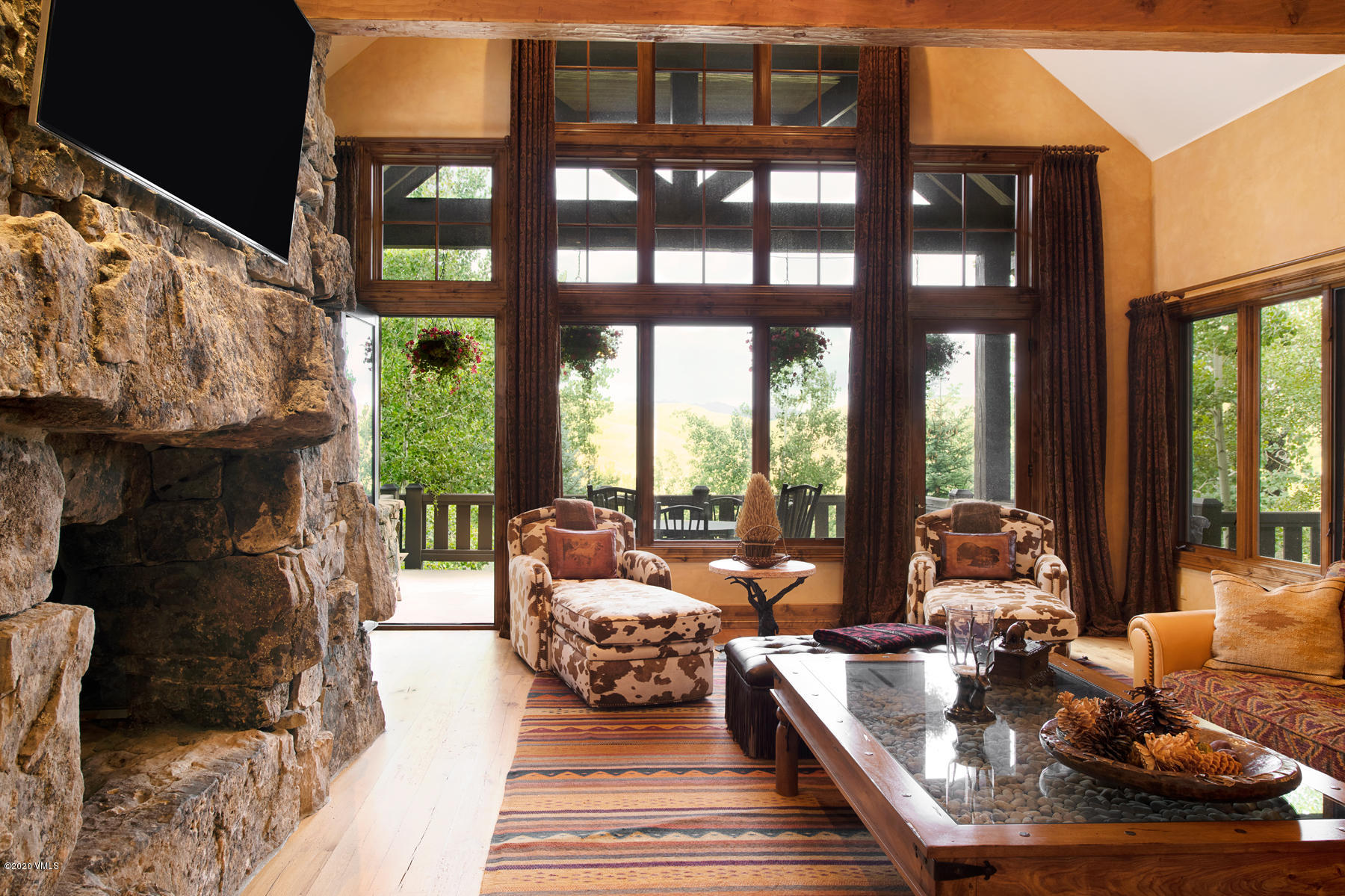 919 Bachelor Ridge Road Avon, CO 81620 - Photo 6 of 31 a living room with furniture and large windows