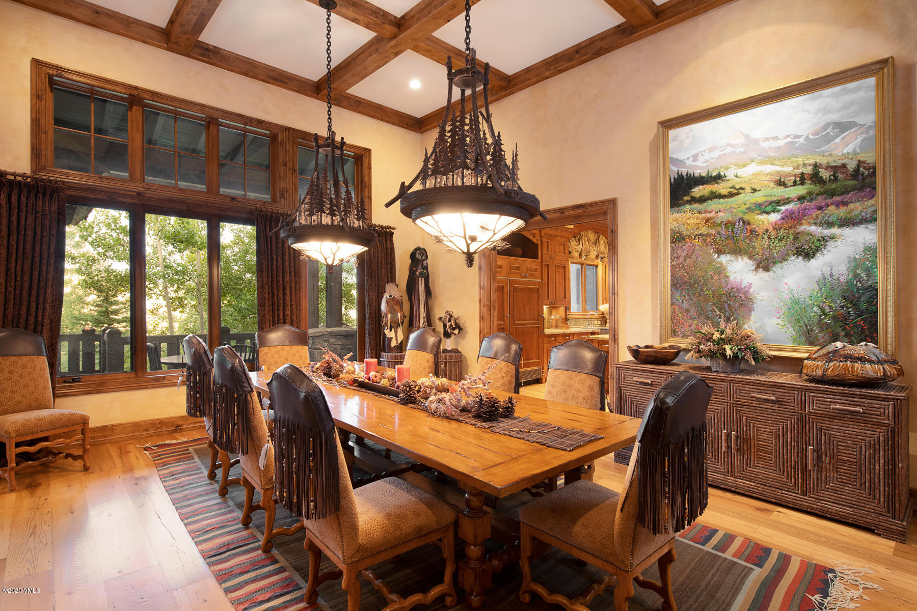 919 Bachelor Ridge Road Avon, CO 81620 - Photo 7 of 31 a view of a dining room with furniture large windows and wooden floor