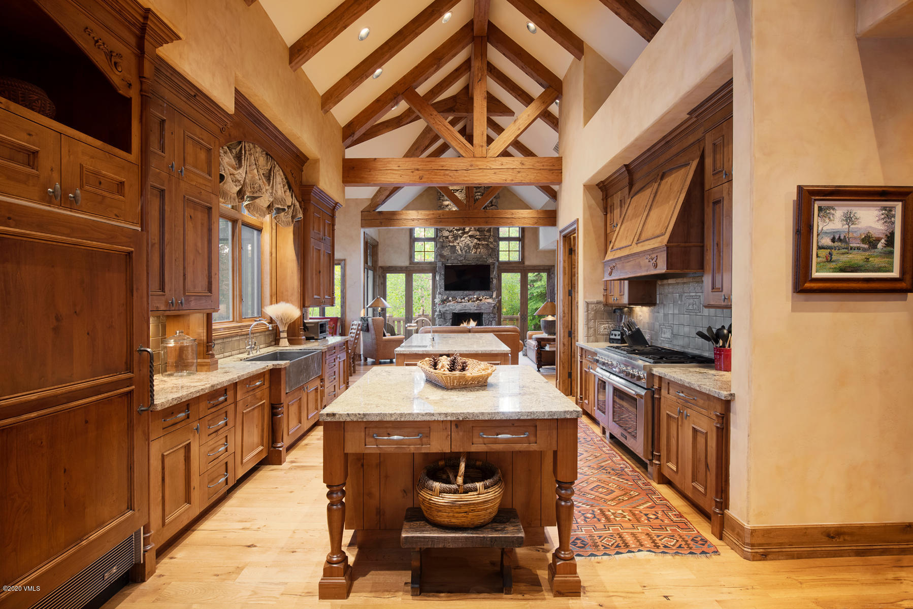 919 Bachelor Ridge Road Avon, CO 81620 - Photo 8 of 31 a kitchen with stainless steel appliances granite countertop a stove a sink and a refrigerator