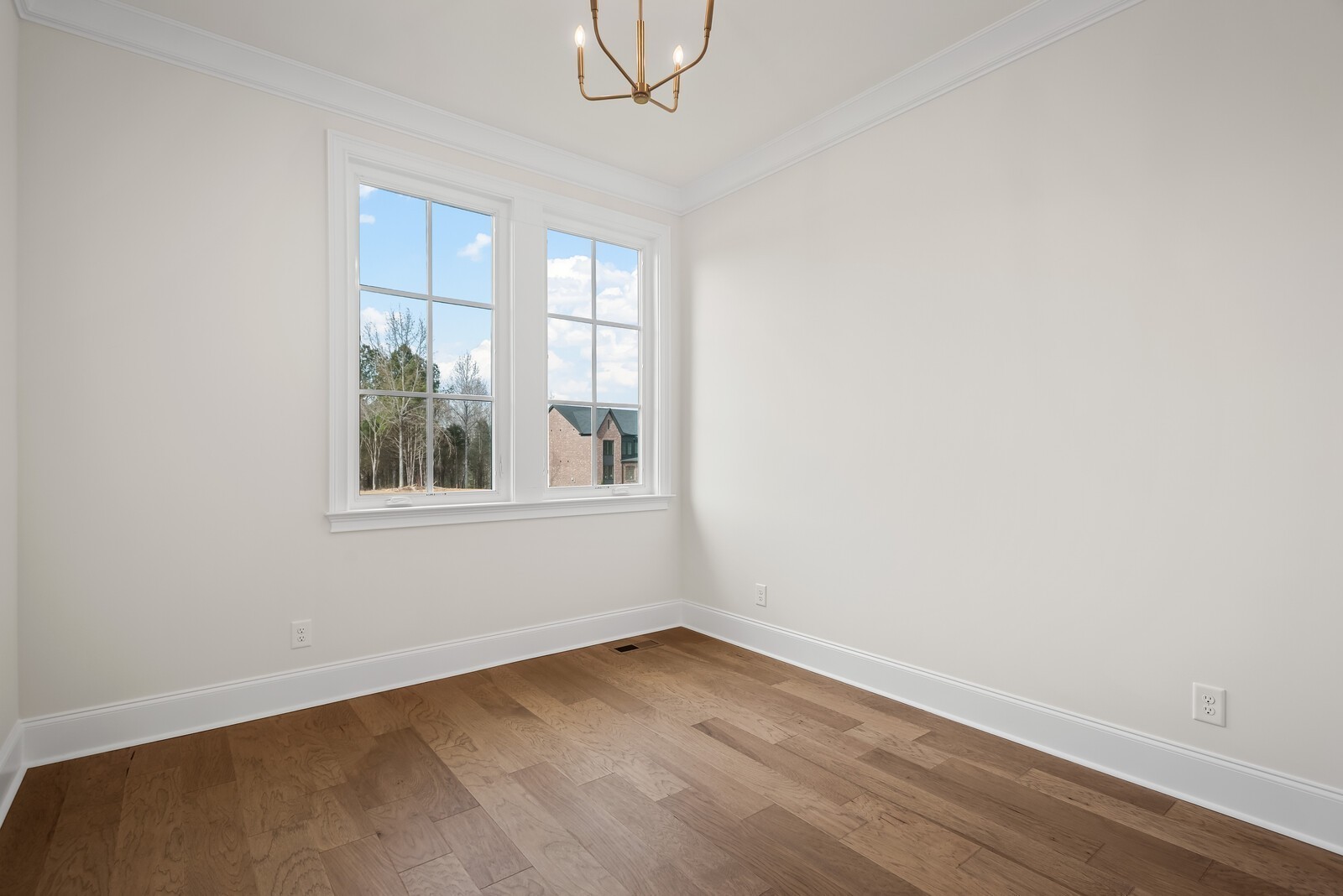 7217 Severide Street Fairview, TN 37062 - Photo 12 of 63 an empty room with wooden floor and windows