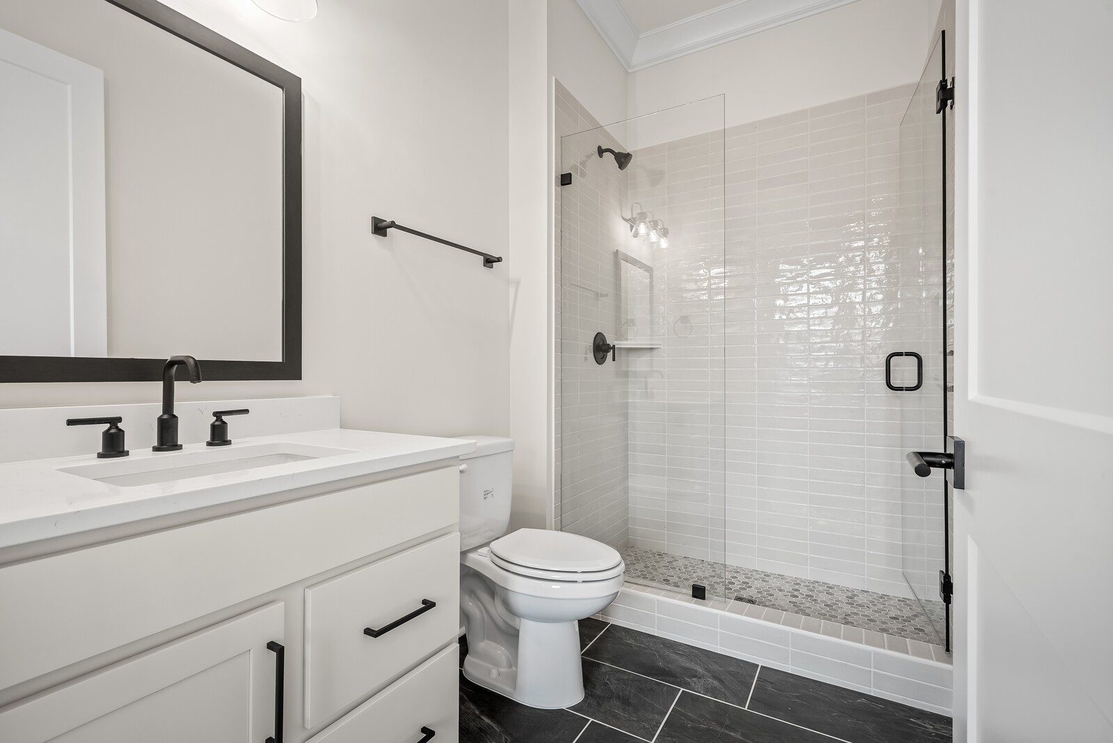 7217 Severide Street Fairview, TN 37062 - Photo 14 of 63 a bathroom with a sink toilet a mirror and shower