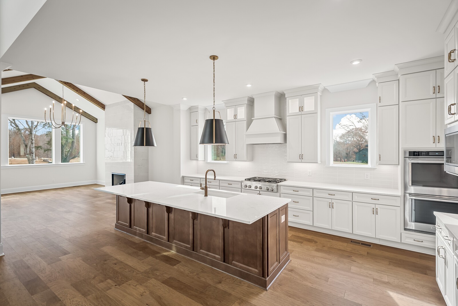 7217 Severide Street Fairview, TN 37062 - Photo 18 of 63 a large kitchen with kitchen island a sink stainless steel appliances and white cabinets