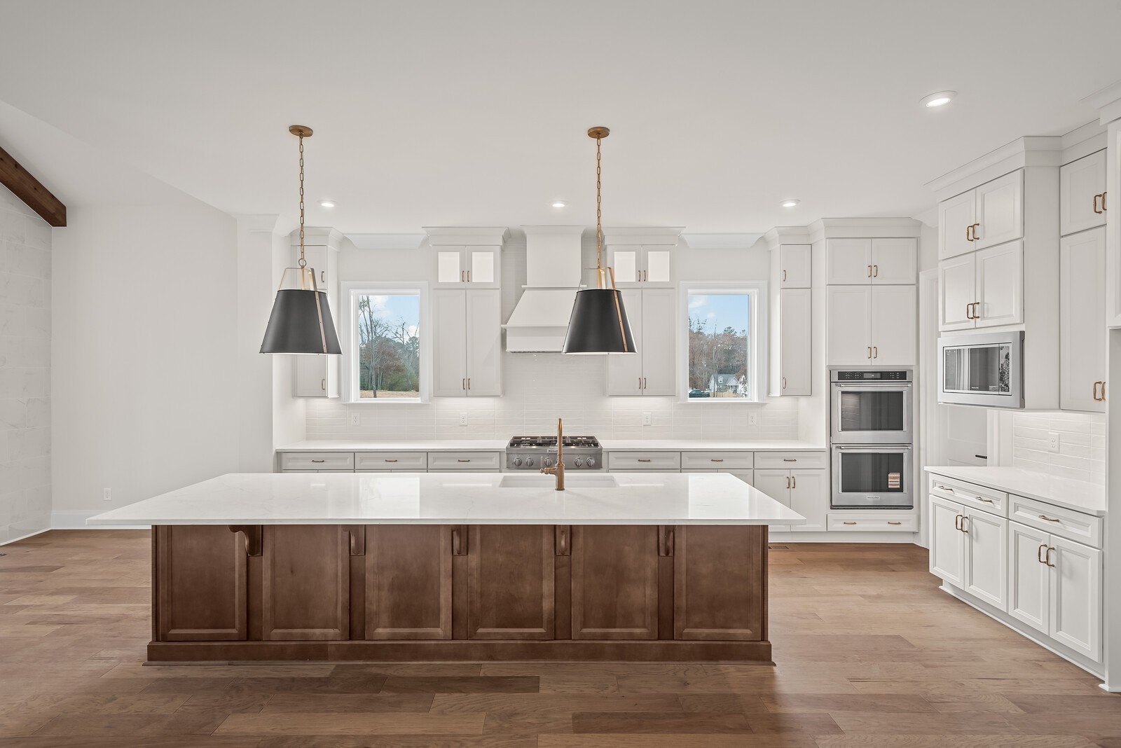 7217 Severide Street Fairview, TN 37062 - Photo 19 of 63 a kitchen with stainless steel appliances kitchen island granite countertop a cabinets and a chandelier