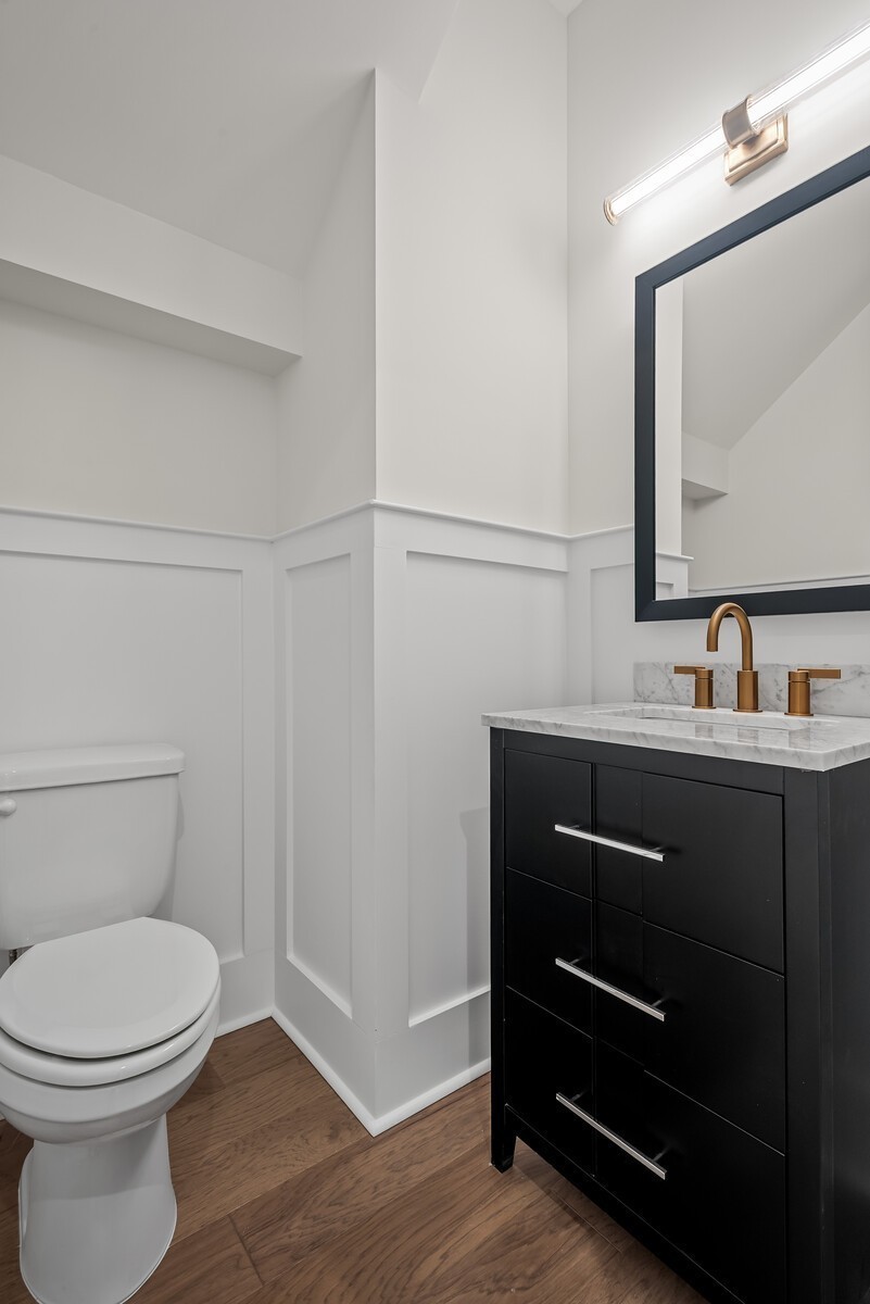 7217 Severide Street Fairview, TN 37062 - Photo 31 of 63 a bathroom with a toilet a sink and mirror