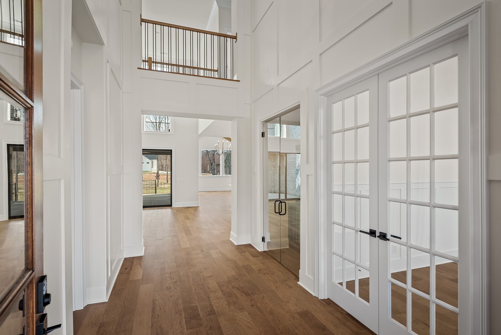 7217 Severide Street Fairview, TN 37062 - Photo 7 of 63 a view of a hallway with wooden floor and entryway
