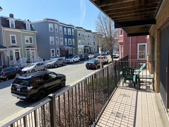a view of a balcony with chairs