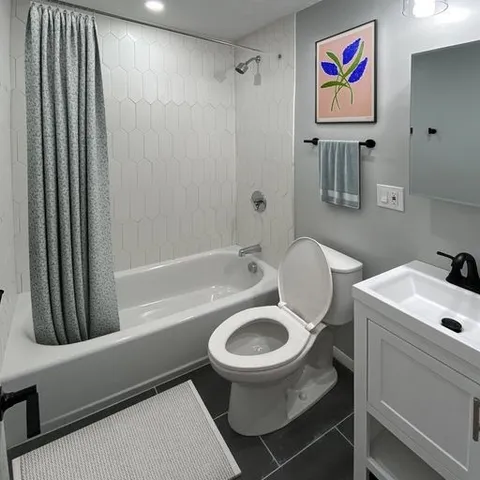 a bathroom with a sink a toilet and a bathtub
