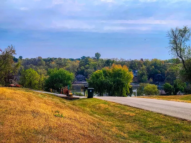 a view of a swimming pool with an outdoor seating and a yard