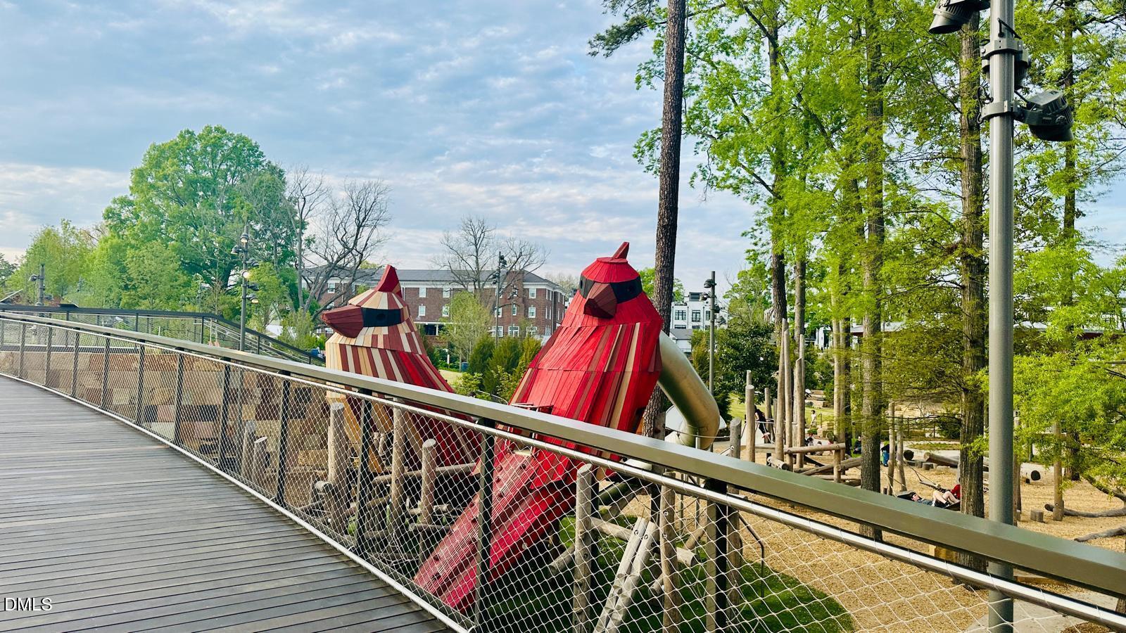 901 Kildaire Farm Road, Unit D1 Cary, NC 27511 - Photo 12 of 13 a view of a balcony with lots of trees and wooden fence