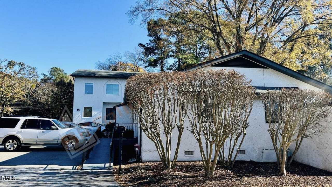 901 Kildaire Farm Road, Unit D1 Cary, NC 27511 - Photo 3 of 13 a front view of a house with garden