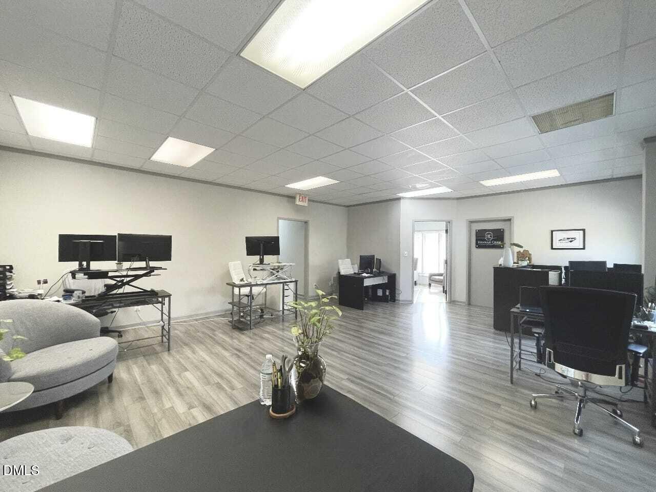 901 Kildaire Farm Road, Unit D1 Cary, NC 27511 - Photo 6 of 13 a living room with furniture and a wooden floor