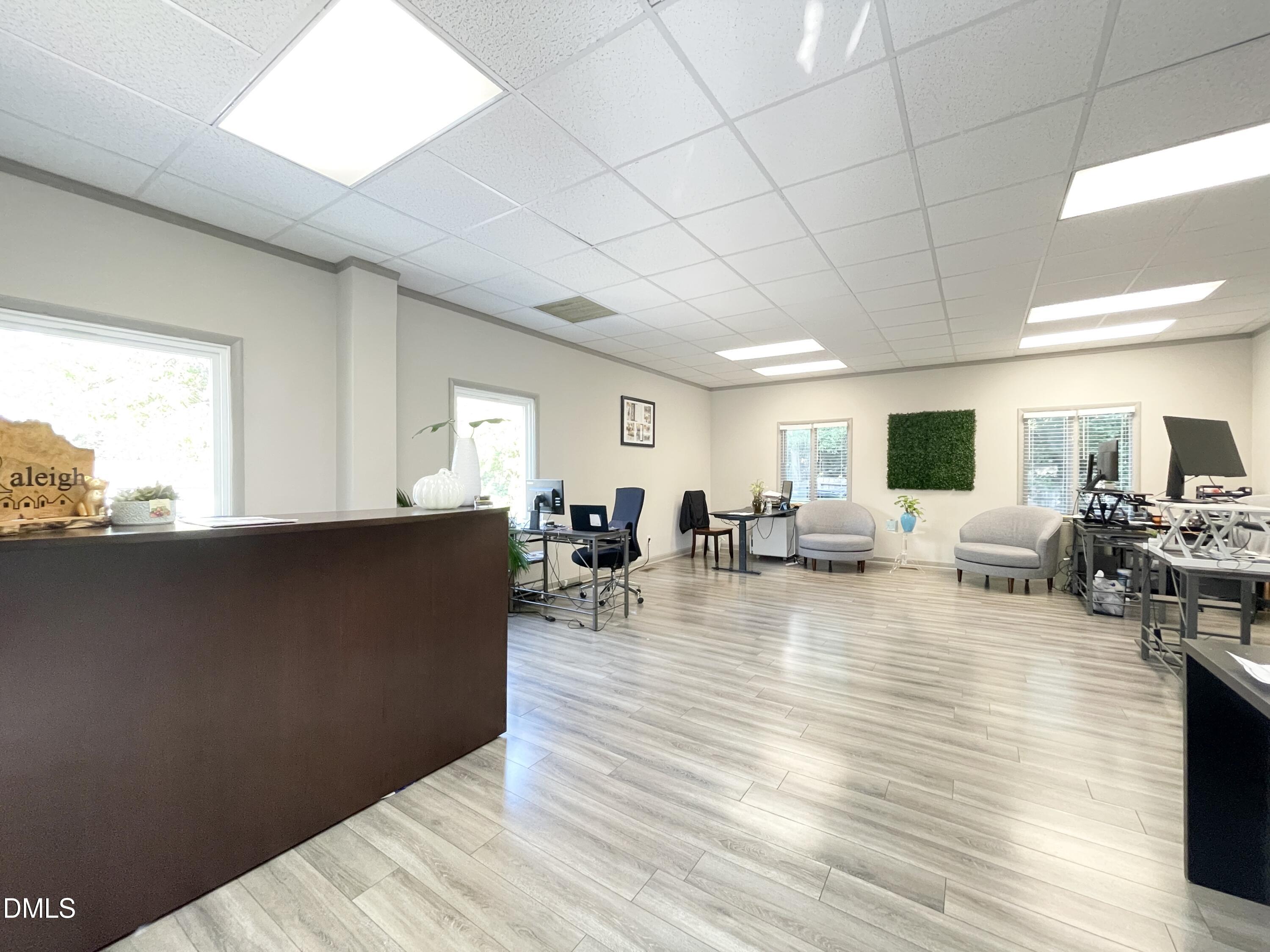 901 Kildaire Farm Road, Unit D1 Cary, NC 27511 - Photo 7 of 13 a living room with furniture and wooden floor