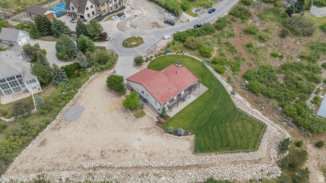 4221 Juniper Circle Alpine, UT 84004 - Photo 59 of 66 Expansive property featuring a red-roofed residence, a terraced lawn, and a spacious deck