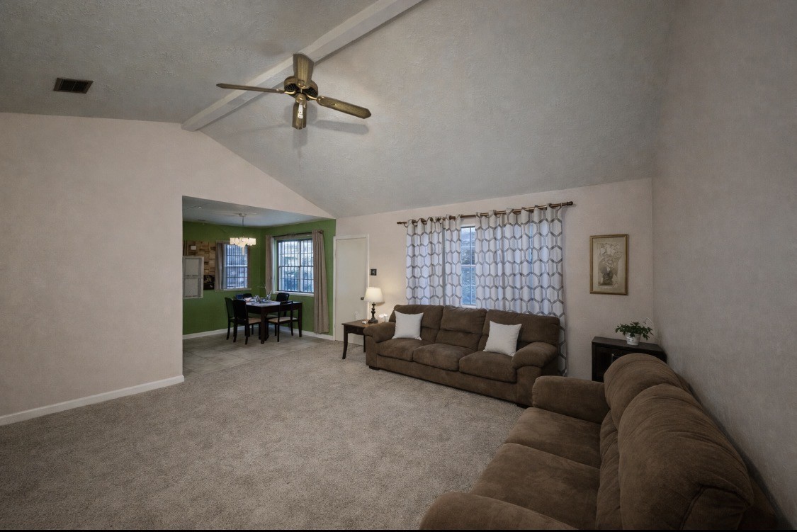 2102 Snowdrop Lane Houston, TX 77067 - Photo 8 of 9 a living room with furniture and a large window