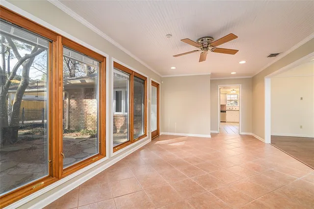 a bathroom with a granite countertop sink a mirror and bathtub