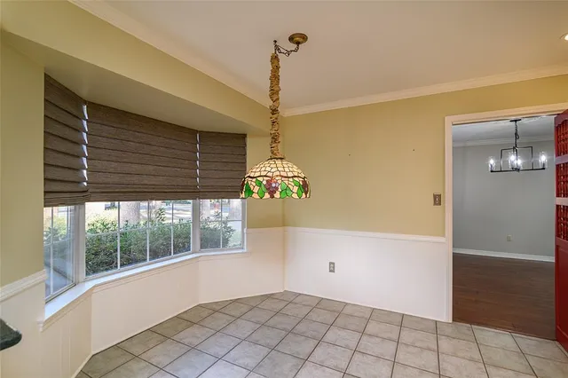 a living room with furniture and a view of kitchen