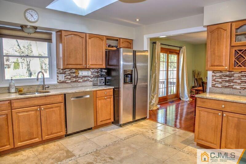 36 Edgewood Road Edison, NJ 08820 - Photo 11 of 23 a kitchen with stainless steel appliances granite countertop a refrigerator and a sink