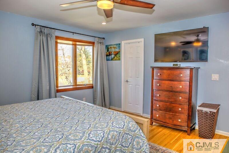 36 Edgewood Road Edison, NJ 08820 - Photo 14 of 23 a bedroom with a bed and a flat screen tv