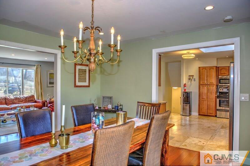 36 Edgewood Road Edison, NJ 08820 - Photo 5 of 23 a view of a dining room with furniture wooden floor and chandelier