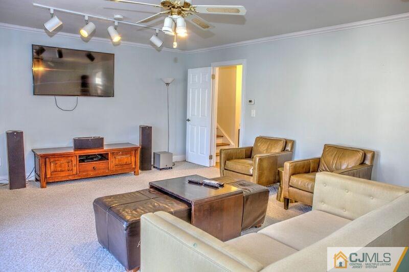 36 Edgewood Road Edison, NJ 08820 - Photo 7 of 23 a living room with furniture and a flat screen tv