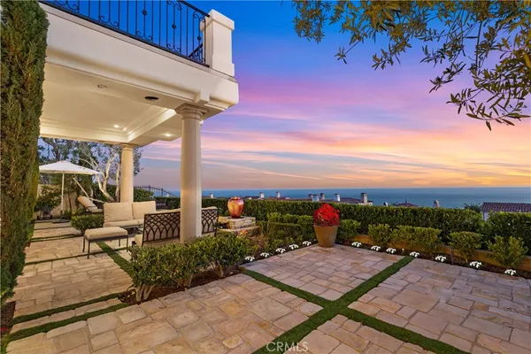 a view of a table and chairs under an umbrella