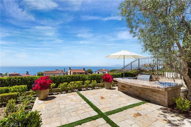 a view of empty room with fireplace and fan