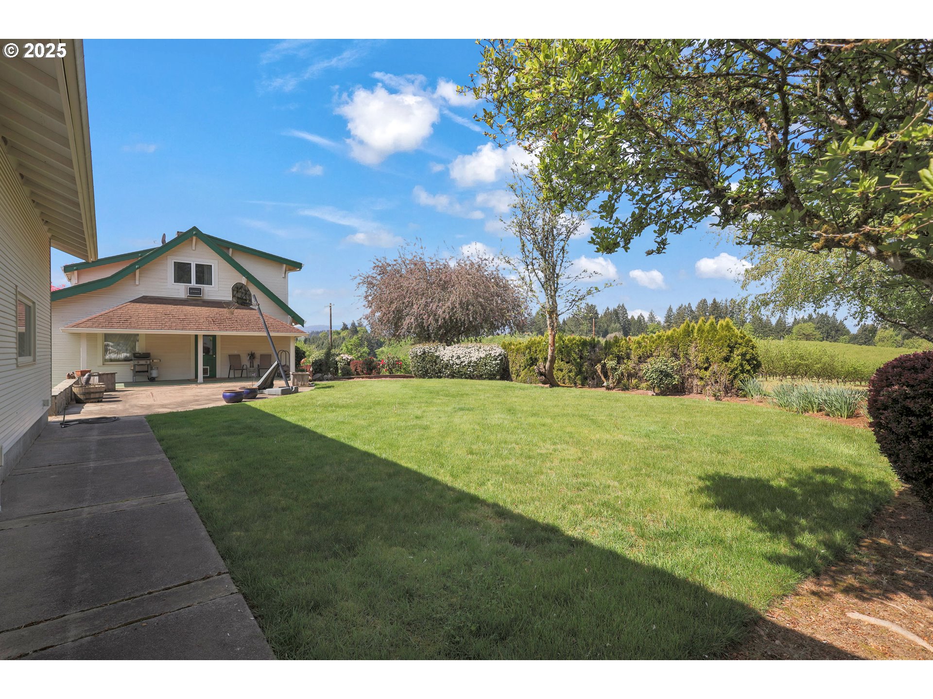 48025 Northwest Strohmayer Road Forest Grove, OR 97116 - Photo 30 of 30 a front view of a house with garden