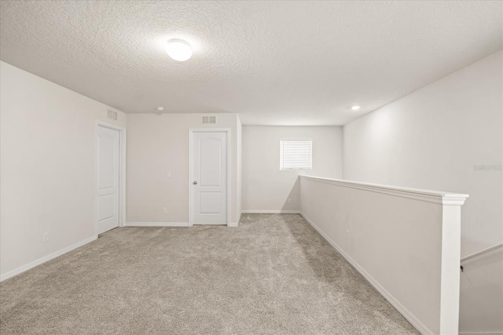 5192 Chickadee Street St. Cloud, FL 34771 - Photo 15 of 35 a view of an empty room