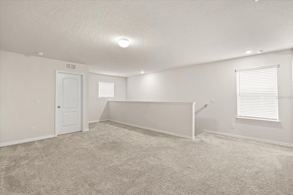 5192 Chickadee Street St. Cloud, FL 34771 - Photo 16 of 35 a view of an empty room with a window