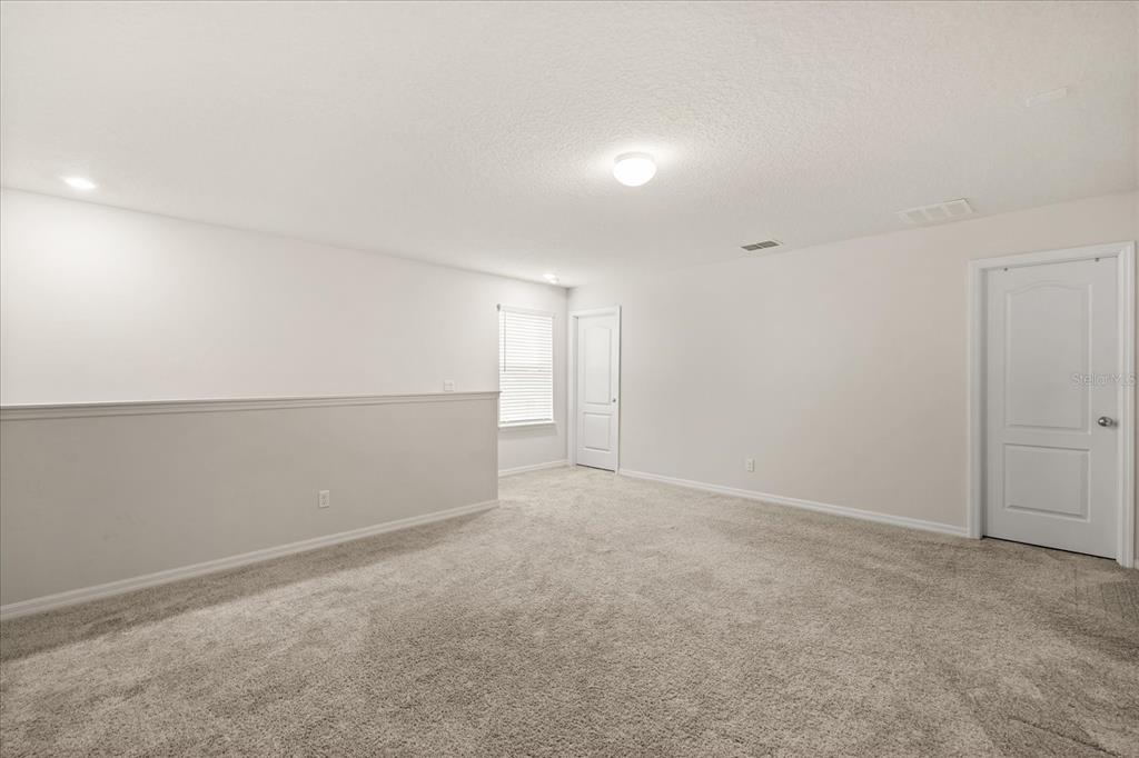 5192 Chickadee Street St. Cloud, FL 34771 - Photo 17 of 35 a view of an empty room