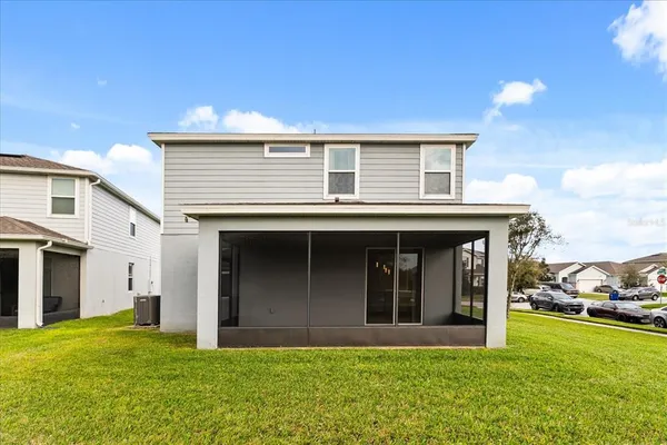 a view of a house with a yard