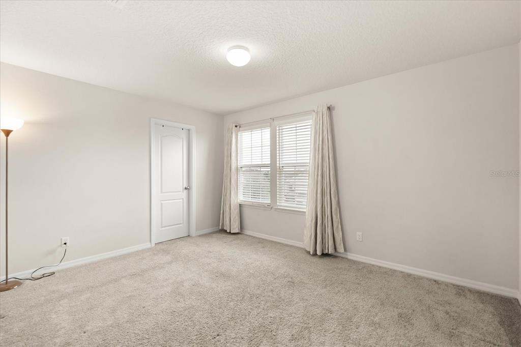 5192 Chickadee Street St. Cloud, FL 34771 - Photo 25 of 35 an empty room with windows