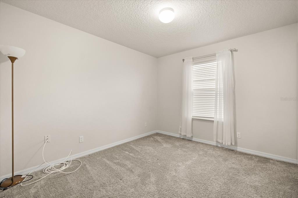 5192 Chickadee Street St. Cloud, FL 34771 - Photo 28 of 35 an empty room with windows