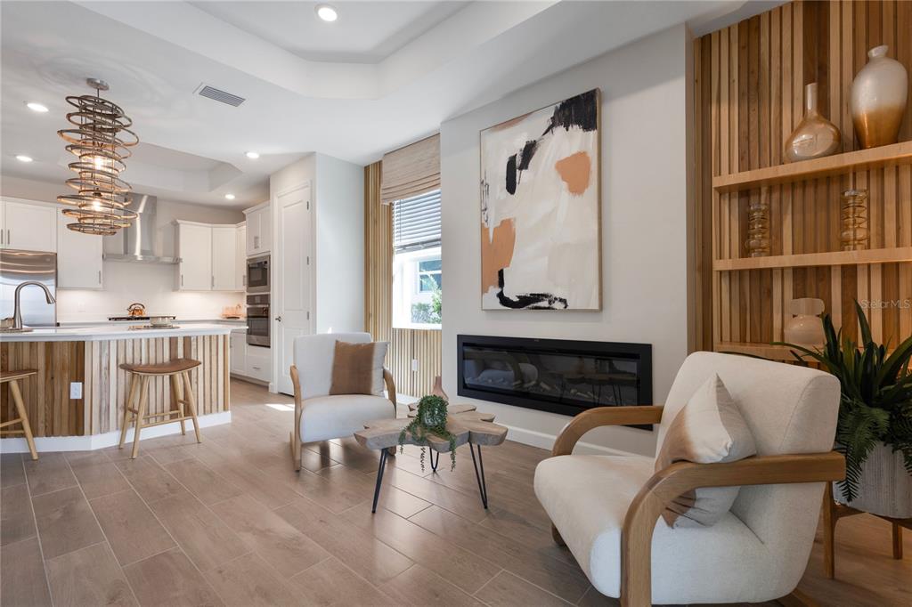 7157 Inlet Isles Lakewood Ranch, FL 34202 - Photo 11 of 26 a living room with furniture and a fireplace