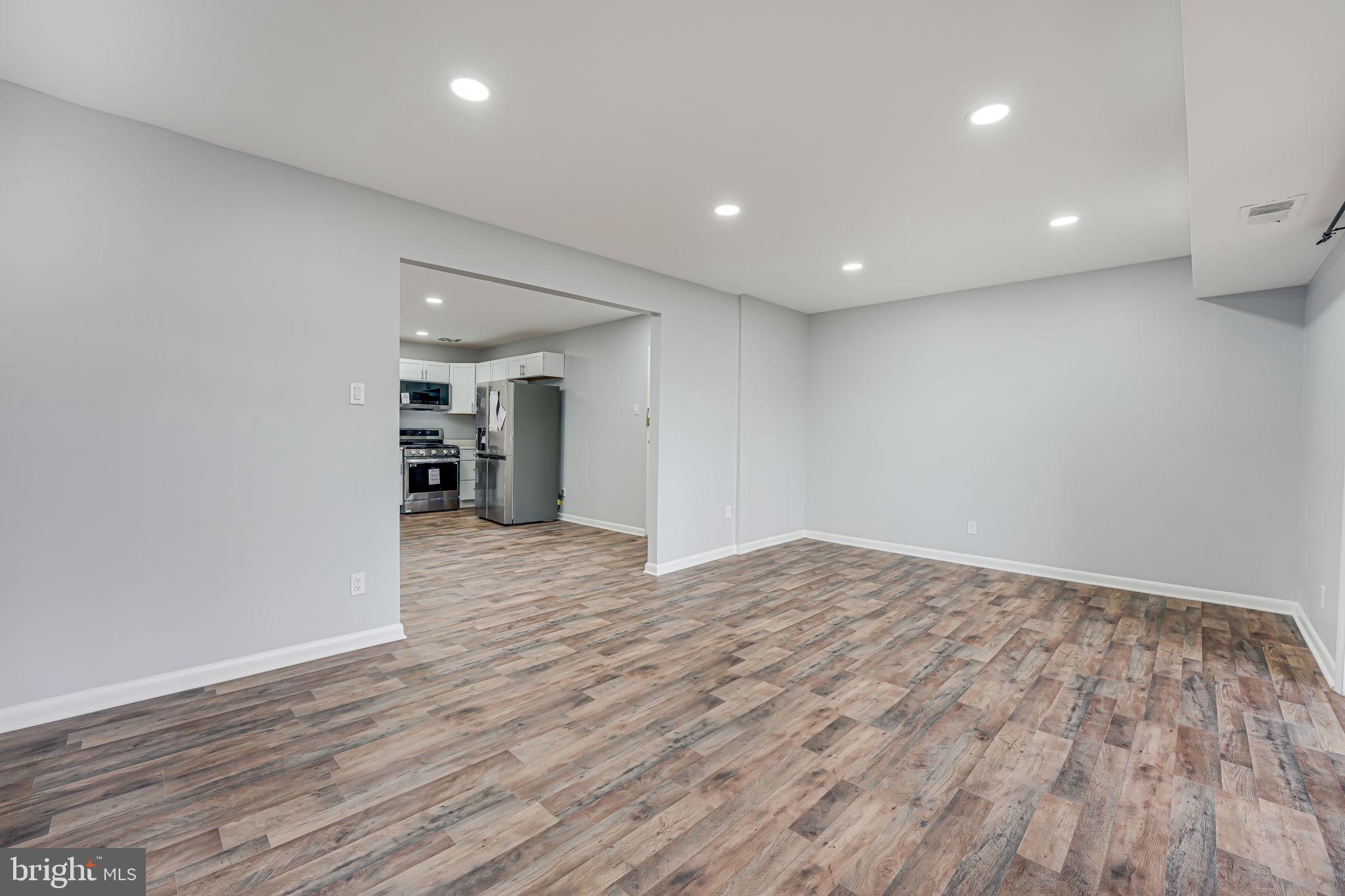 11601 Vantage Hill Road, Unit 22B Reston, VA 20190 - Photo 7 of 37 Open living space; leads to kitchen.