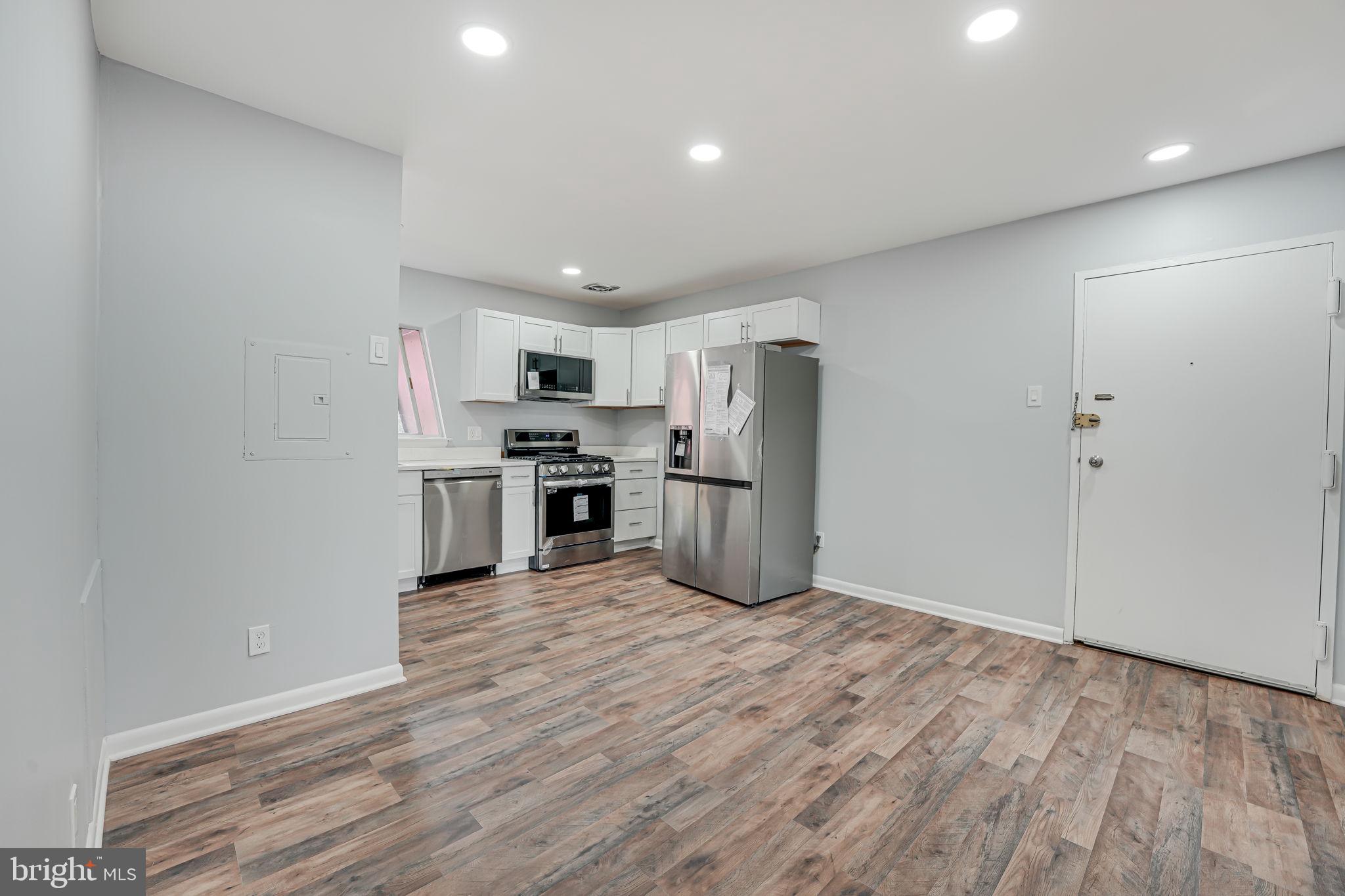 11601 Vantage Hill Road, Unit 22B Reston, VA 20190 - Photo 8 of 37 Open living ; better view of kitchen.