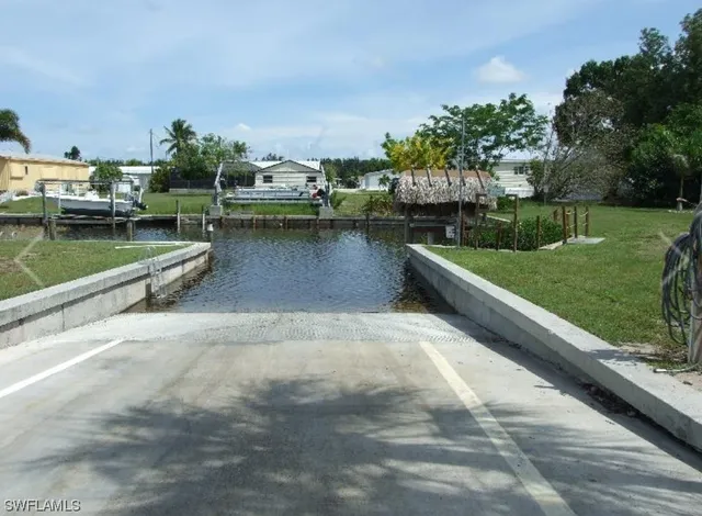a view of street with tall trees